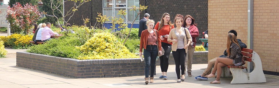 students walking through campus